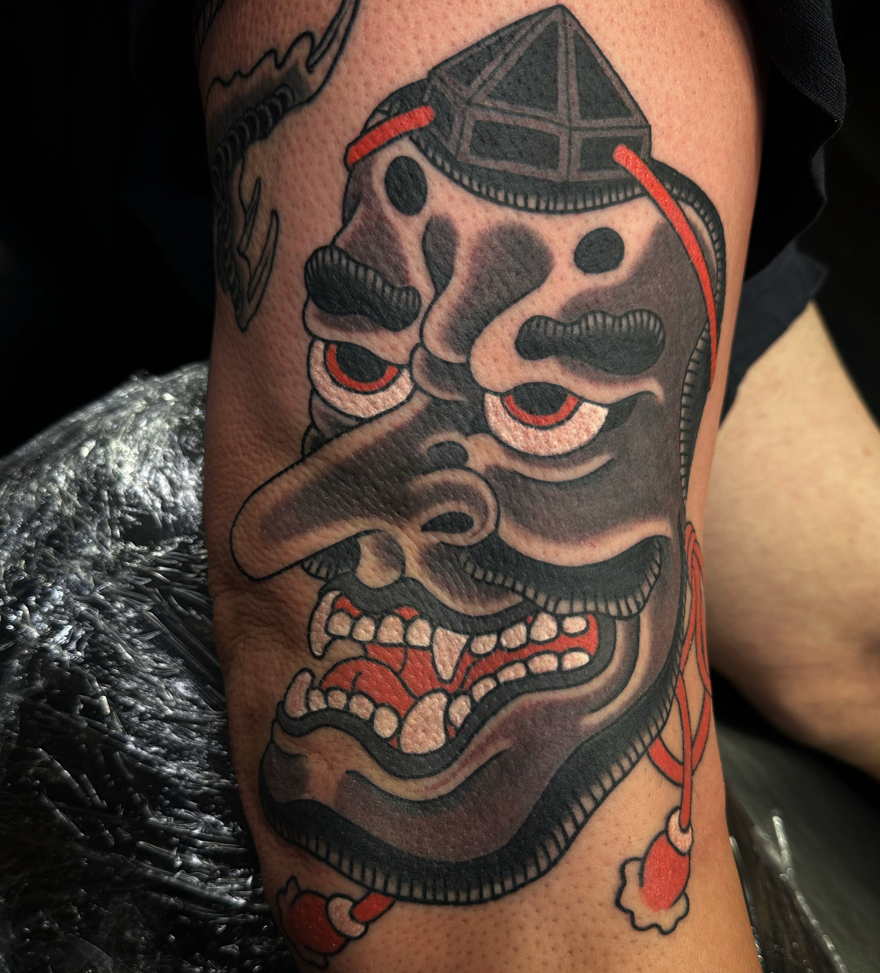 Black and grey Japanese tenge mask tattoo