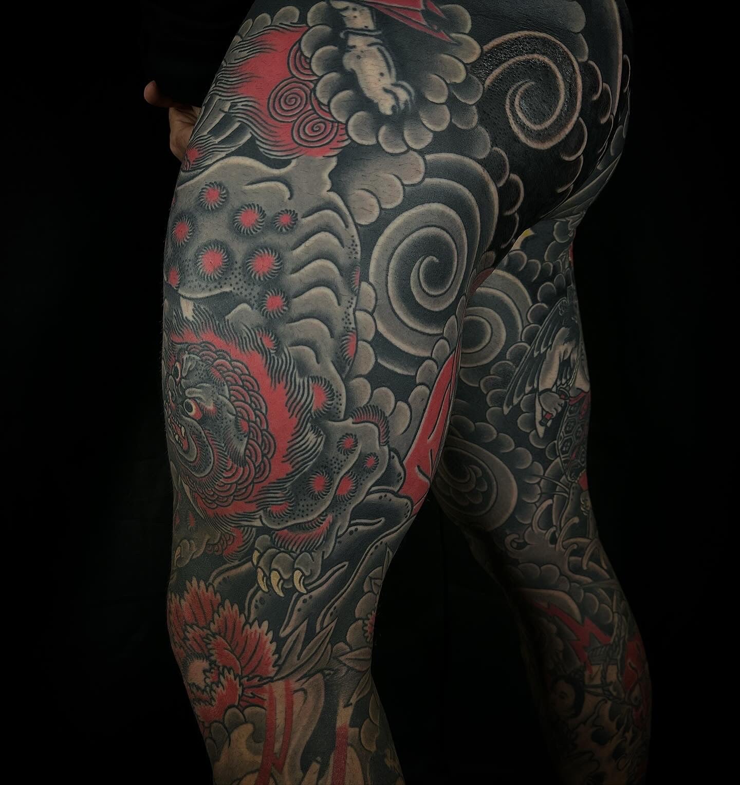 Japanese foo dog and peony leg sleeve tattoo