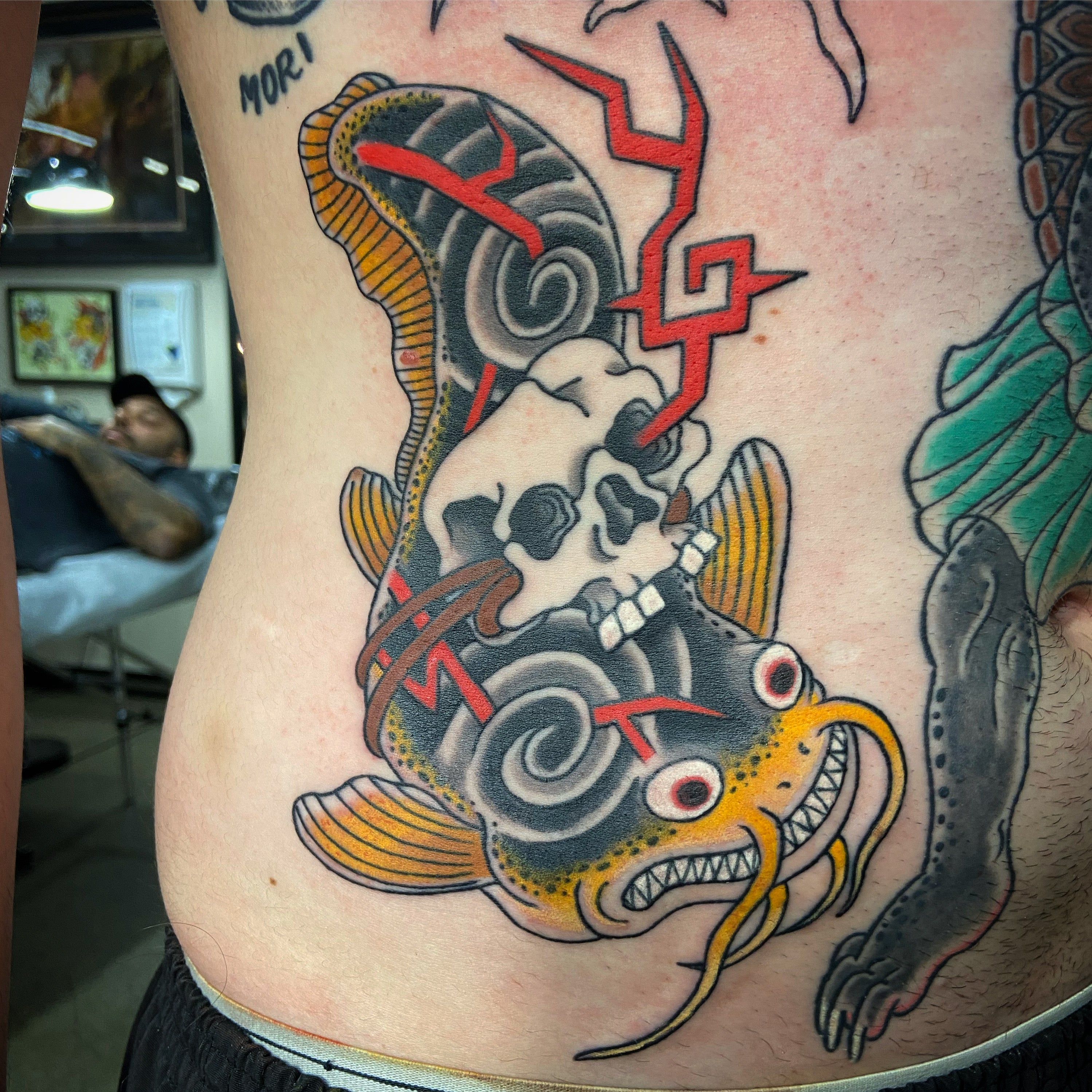 Japanese yokai namazu with skull and lightning tattoo